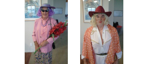 Village Manager and a Resident Dressed as Dame Edna (Left) and Dolly Parton (Right)