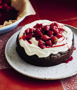 Chocolate and hazelnut caprese cake with wine-roasted strawberries