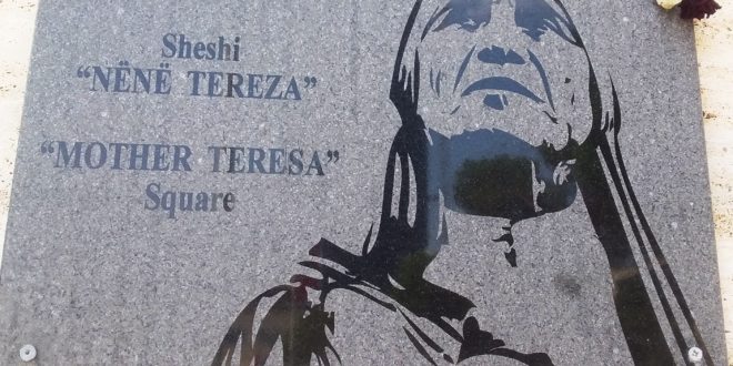 The large plaque in Mother Teresa Square Tirane. Note the floral tribute top right corner. 1
