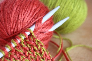 Wool and knitting needles closeup.